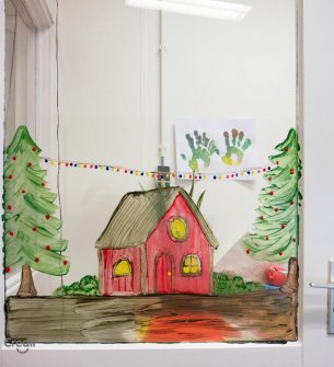 Window painting of cozy Christmas house